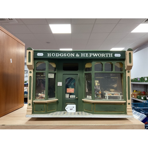 387 - A Doll's House Diarama, of 'Hodgson and Hepworth' an early XX Century Grocers Shop, fully fitted wit... 