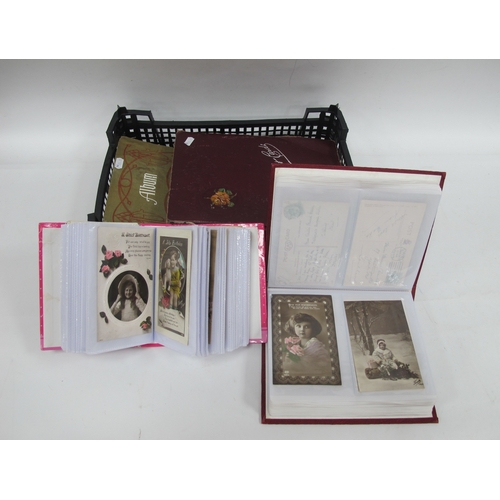 1103 - Postcards, mainly sentimental, early XX Century, large quantity, housed in two period and two later ... 