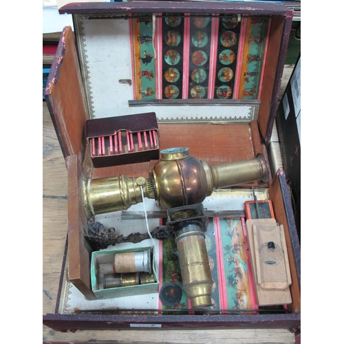 1114 - Early XX Century Brass Magic Lantern, possibly Triumph with a quantity of slides, in original (damag... 