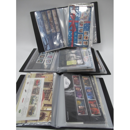 1270 - Stamps: Four Presentation Books, containing mint GB presentation packs, all millennium and later, wi... 