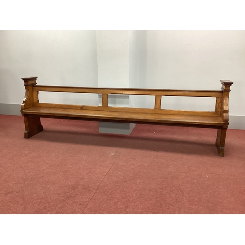 1496 - A XIX Century Pitch Pine Pew, with open back and shaped end supports, 295cm wide.