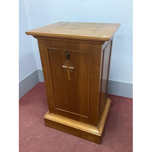 1502 - An Oak Pedestal, applied to the front with a cross, on a plinth base, 66cm wide.