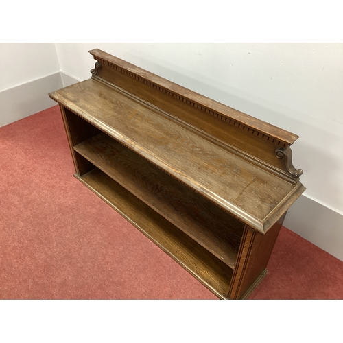 1510 - A XX Century Table Top Oak Bookcase, the back with dentil cornice and scroll shaped ends and adjusta... 