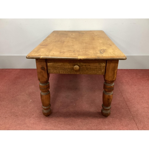 1516 - A XIX Century Pine Table, with rectangular top and single drawer, raised on turned and block support... 