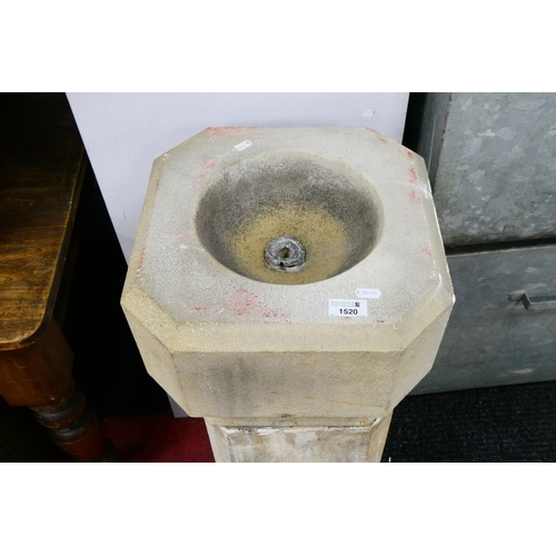 1520 - A Stone Font, with octagonal top and chamfered pedestal, 100cm high.