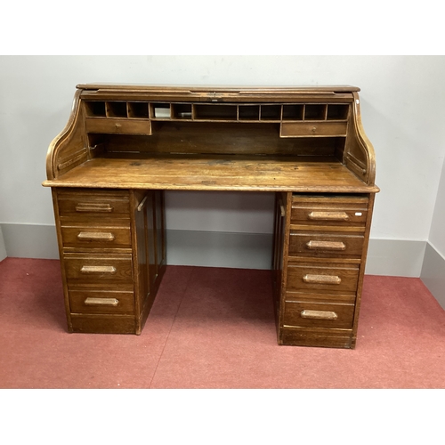 1524 - An Early XX Century Oak Roll Top Desk, with tambour fall to fitted interior, twin pedestals each wit... 
