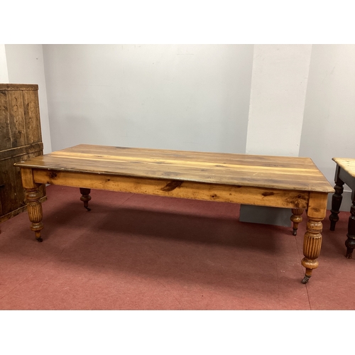 1537 - A XIX Century Pine Kitchen Table, with rectangular top on turned and reeded supports, 236cm wide.