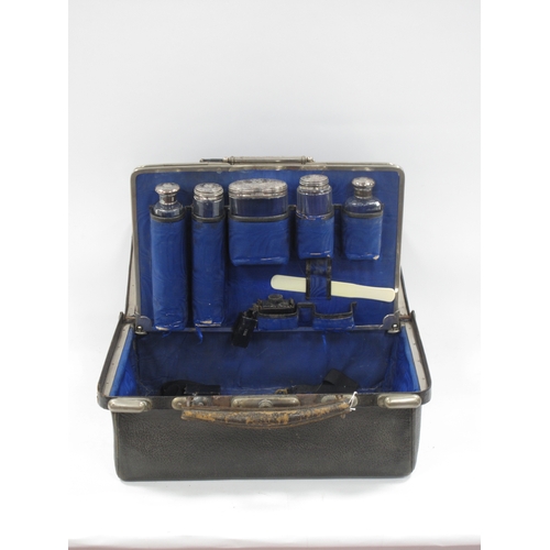 1398 - Late XIX Century Black Morocco Gladstone Bag, containing five silver topped bottles, Birmingham & Lo... 