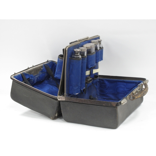 1398 - Late XIX Century Black Morocco Gladstone Bag, containing five silver topped bottles, Birmingham & Lo... 