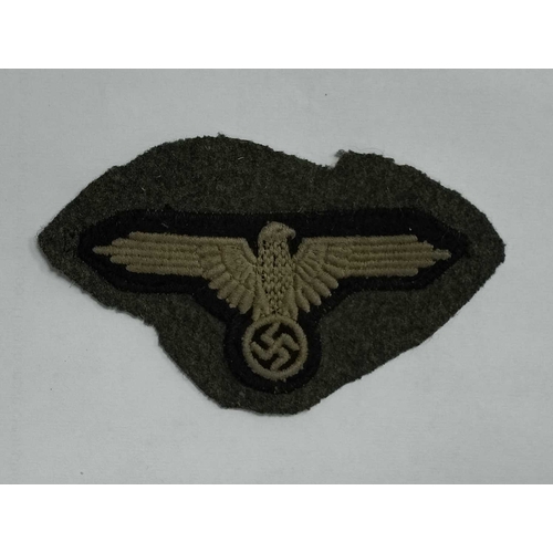 1300 - Collectables, reproduction German Armed Forces Insignia, including Demjansk Campaign shield and belt... 