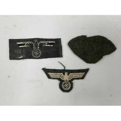 1300 - Collectables, reproduction German Armed Forces Insignia, including Demjansk Campaign shield and belt... 