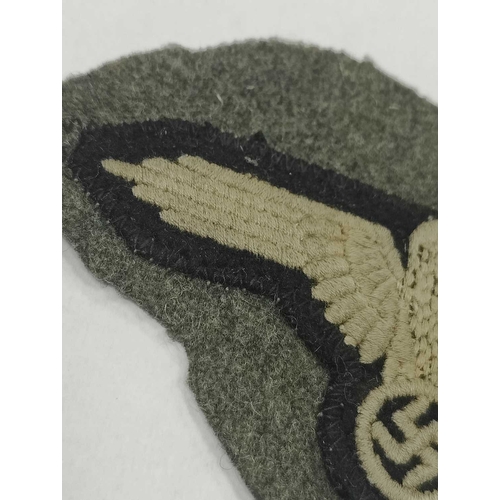 1300 - Collectables, reproduction German Armed Forces Insignia, including Demjansk Campaign shield and belt... 