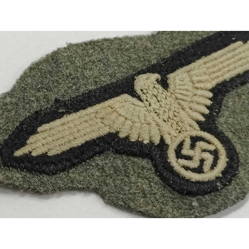 1300 - Collectables, reproduction German Armed Forces Insignia, including Demjansk Campaign shield and belt... 