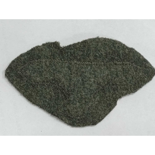 1300 - Collectables, reproduction German Armed Forces Insignia, including Demjansk Campaign shield and belt... 