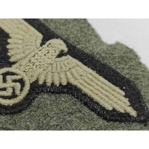 1300 - Collectables, reproduction German Armed Forces Insignia, including Demjansk Campaign shield and belt... 