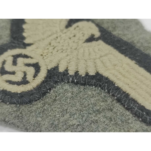 1300 - Collectables, reproduction German Armed Forces Insignia, including Demjansk Campaign shield and belt... 