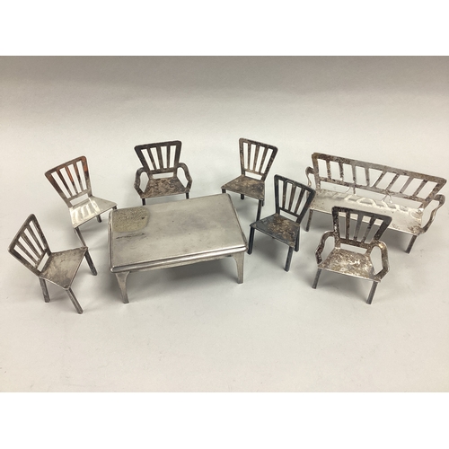 8 - Vintage Electroplated Doll's House Furniture, comprising rectangular table (9.7cm wide, 4.3cm high) ... 