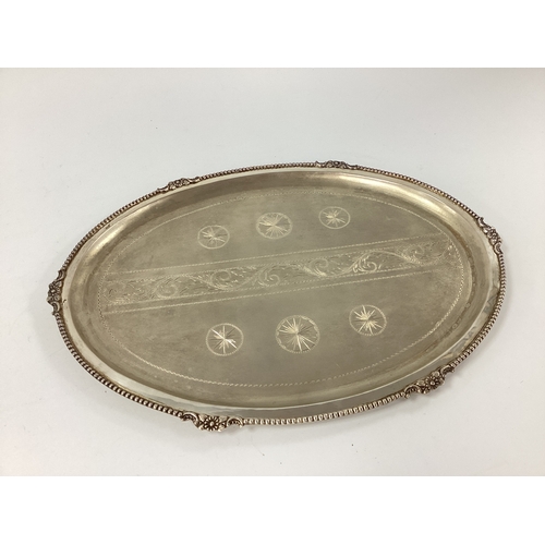 20 - A Decorative Eastern Oval Tray, satin and polished finish, with engraved decoration, within textured... 