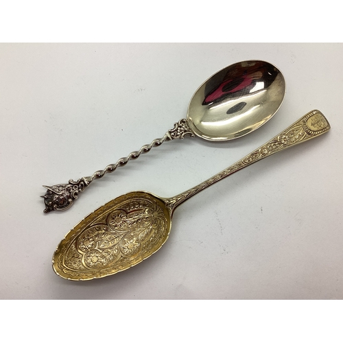 31 - A Highly Decorative Hallmarked Silver Gilt Dessert / Berry Spoon, (bottom struck) TS (unclear), prof... 