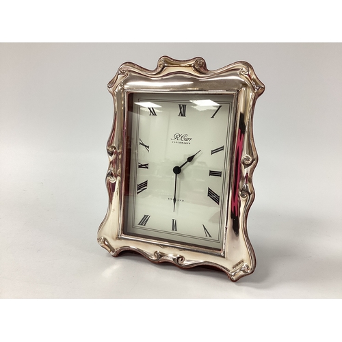32 - R Carr (Sheffield) Hallmarked Silver Mounted Mantel Clock, Sheffield 1994, of scroll design, 19cm.