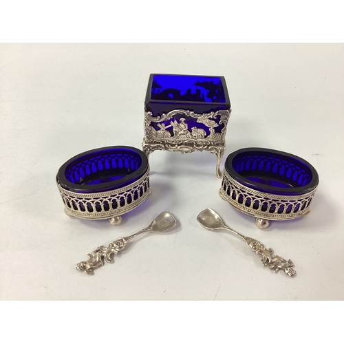35 - Wilhelm T Binder; A Pair of German Salts, each of oval geometric pierced form, with blue glass liner... 