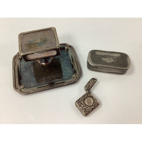 40 - A Hallmarked Silver Vesta Case, of allover foliate design, with initialled circular cartouche; an El... 