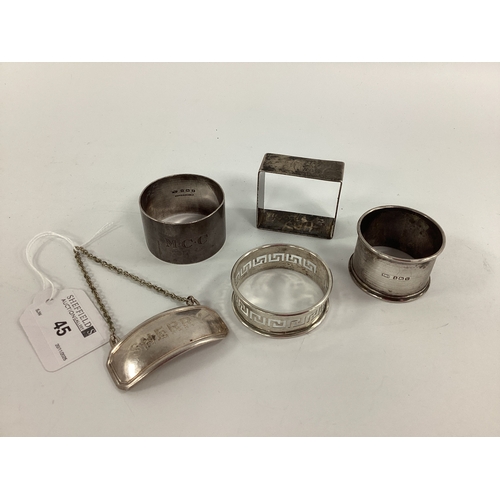 45 - Three Hallmarked Silver Napkin Rings, together with a square example (stamped 
