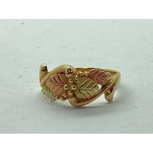 56 - QVC; A Black Hills Gold Style Grapes and Leaf Vine Ring, of two tone textured design, between scroll... 