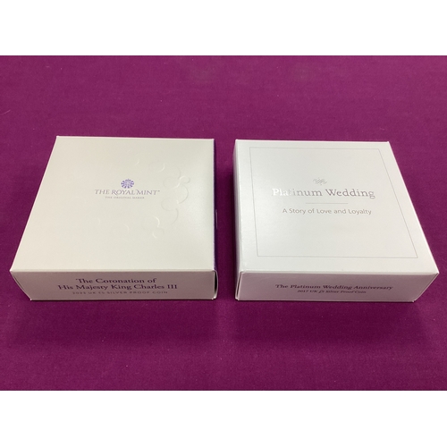 142 - Two Royal Mint UK Silver Proof £5 Coins, includes a 2017 Platinum Wedding Anniversary and a 2023 Cor... 