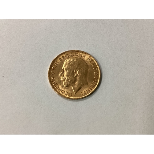 214 - 1915 George V Gold Half Sovereign, together with an 1883 USA silver 'Morgan Dollar', 1966 Spain 100 ... 