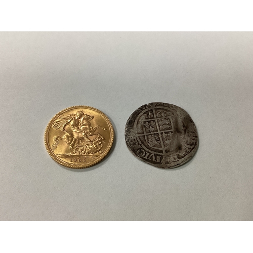 223 - 1965 QEII Gold Sovereign, together with a 1566 Elizabeth I well circulated silver Sixpence.