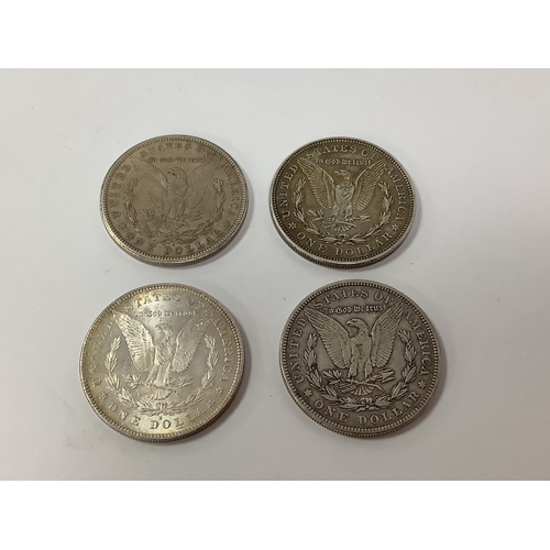 59 - Four USA Silver 'Morgan' Dollars, 1878, 1904 and two 1921.
