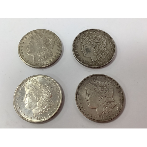59 - Four USA Silver 'Morgan' Dollars, 1878, 1904 and two 1921.