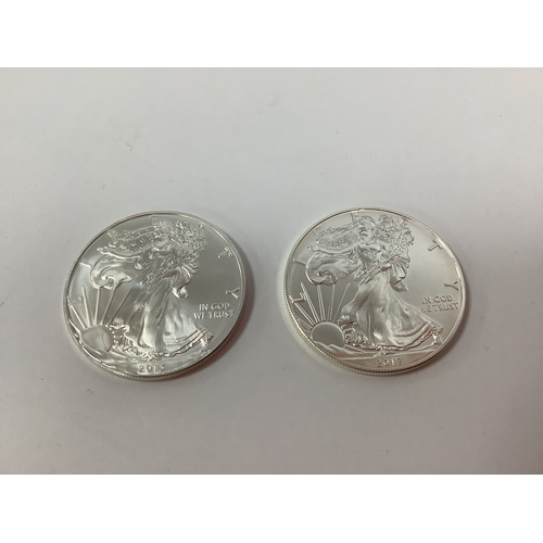 62 - Two USA One Ounce Fine Silver Dollars, 2013 and 2017.