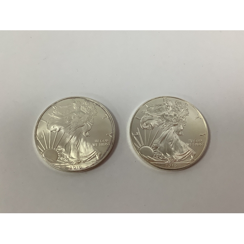 63 - Two USA One Ounce Fine Silver Dollars, 2010 and 2015.