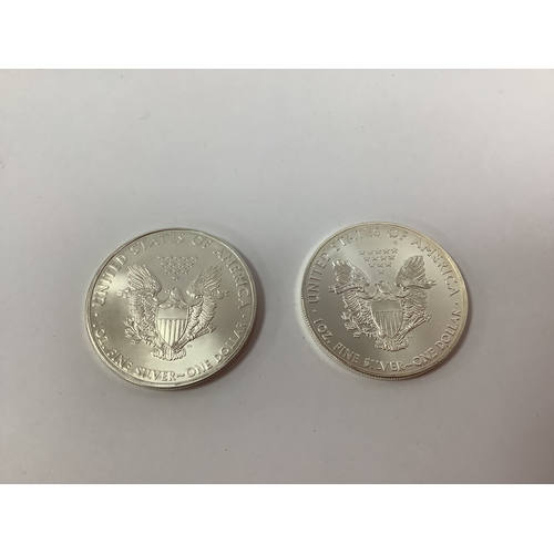 63 - Two USA One Ounce Fine Silver Dollars, 2010 and 2015.