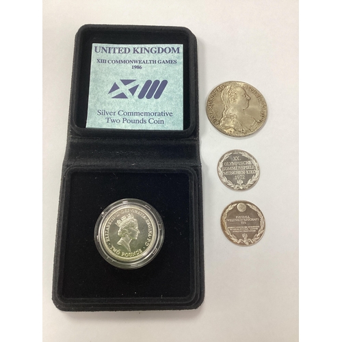 65 - 1986 Royal Mint UK XIII Commonwealth Games Silver £2 Coin, together with a 1780 Maria Theresia silve... 