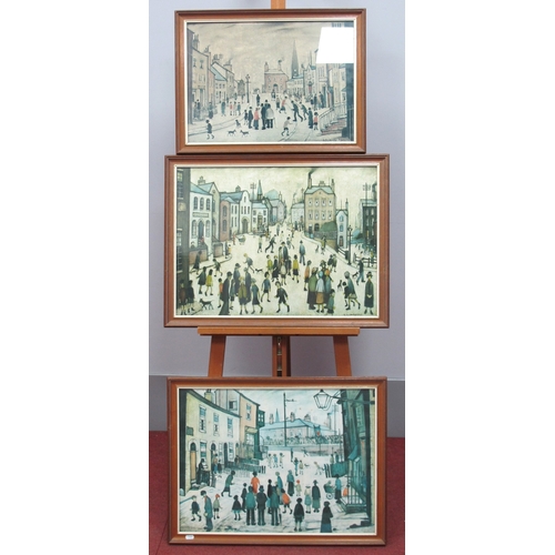 1144 - Three L.S. LOWRY Reproduction Prints *ARR 
'A Village Square', 'A Procession' and 'A Lancashire Vill... 