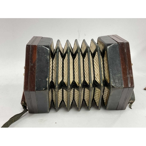 1354 - A Lachenal and Co. Concertina, with twenty bone keys, fretwork ends, paper label, model No. 908601, ... 