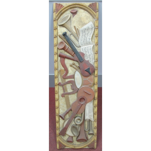 1554 - Fibre Glass Wall Hanging Featuring Stringed and Woodwind Instruments, and music book, 138 x 140cm.