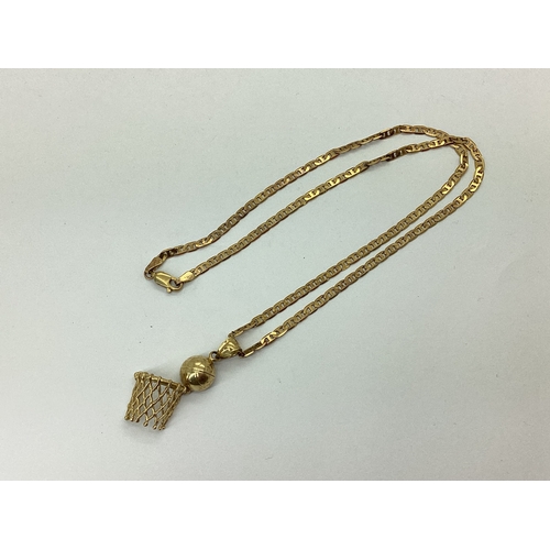 110 - A 9ct Gold Fancy Flat Link Chain, suspending novelty basketball and hoop pendant (stamped 