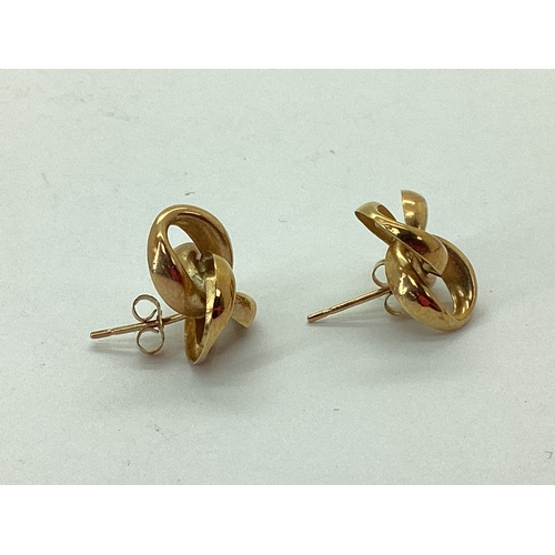 134 - A Pair of Hollow Openwork Knot Earrings, stamped 