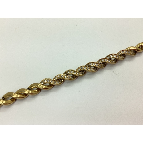 144 - A Fancy Twist Style Bracelet, with inset highlights, to snap clasp, stamped 