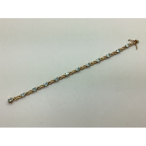 148 - A Modern Stone Set Panel Style Bracelet, oval claw set between inset highlights, to snap clasp. stam... 