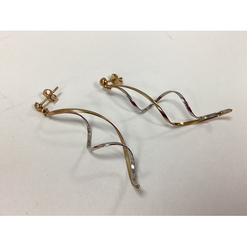 156 - A Pair of Bi-Colour Twist Earrings, of openwork design, to post and scroll fittings, stamped 