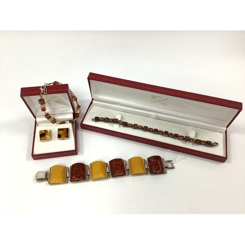 210 - A Chunky Amber Coloured Panel Bracelet, of alternating tones, stamped 