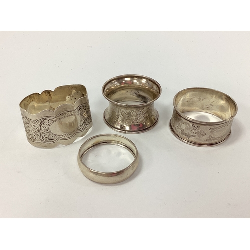29 - Four Assorted Hallmarked Silver Napkin Rings, of various designs (Total weight 40grams). (4)