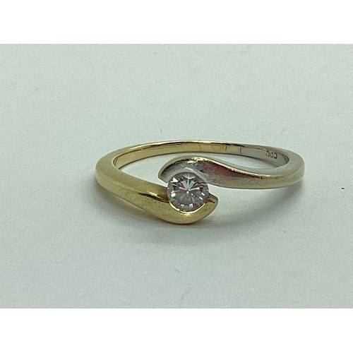 36 - A Modern Bi-Colour Single Stone Ring, of crossover design, stamped 