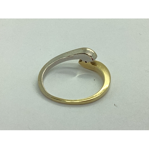 36 - A Modern Bi-Colour Single Stone Ring, of crossover design, stamped 