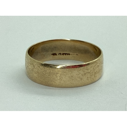 40 - A Plain Wedding Band, indistinctly stamped (finger size N) (2.1grams).